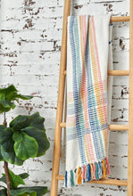 willie multicolored striped throw blanket with tassel fringe styled on blanket ladder