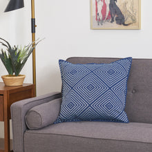 Virginia Indigo Pillow decorated with a geometric and symmetrical embroidered diamond design.