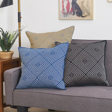 Virginia Pillow Collection decorated with a geometric and symmetrical embroidered diamond design.