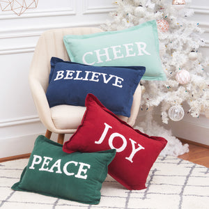 Joy Ruby Decorative Pillow, Peace Jungle Decorative Pillow, Believe Indigo Decorative Pillow, and Cheer Decorative Pillow with high-quality cotton corduroy and hand tufted holiday saying. 