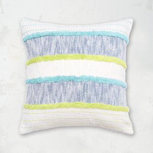 Benn Indigo Pillow styled with woven horizontal patterns and tufted textures.