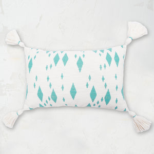 Granby Surf Decorative Pillow featuring spatial diamond geometric design and corner tassels in surf blue colorway.