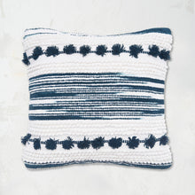 Oriana Indigo Pillow builds a unique pattern through texture with hand woven zig zags and stripes, tufted dots, and hand-tied mini tassels.
