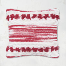 Oriana Ruby Pillow builds a unique pattern through texture with hand woven zig zags and stripes, tufted dots, and hand-tied mini tassels.