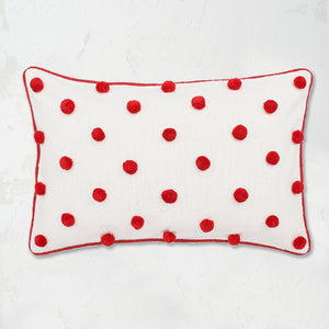 Ruby Dot Oblong Pillow with pom pom embellishments in classic polka dot style with matching border.