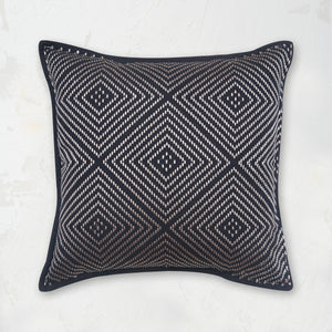 Virginia Onyx Pillow decorated with a geometric and symmetrical embroidered diamond design.