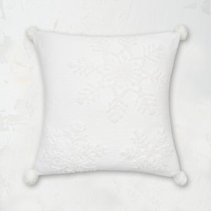 White Snowflake Pillow featuring a pom pom corner tassels and a tufted snowflake pattern on high-quality cotton.