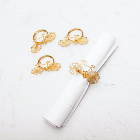 napkin rings embellished with a yellow brass bicycle