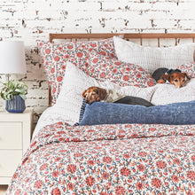 breck quilt set styled with floral accents