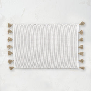 handwoven dune beige and white striped placemat with tassels