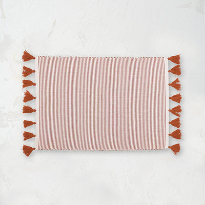 handwoven canyon orange and white striped placemat with tassels