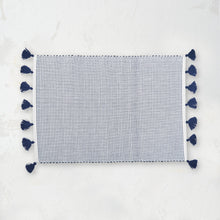 handwoven indigo and white striped placemat with tassels