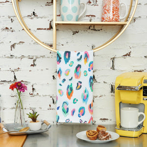 bright leopard kitchen towel hanging over coffee bar