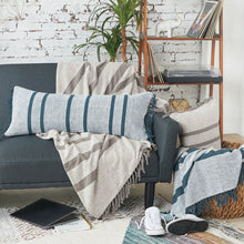 chandler striped decorative pillows and throw blankets on a sofa