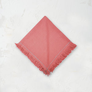 hibiscus pink cheryl cloth napkin with handstitched border and fringed edge