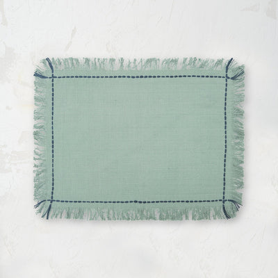 cheryl surf placemat with handstitched border and fringed edge