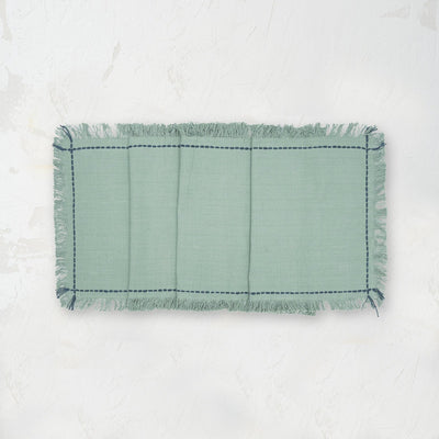 cheryl surf teal table runner with handstitched boarder and fringed edge