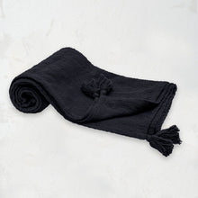 black woven devin throw blanket with tassel detail on the corners