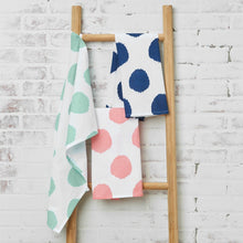 polka dot kitchen towels hanging off of ladder
