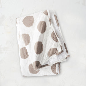 beige and white polka dot pet quilt