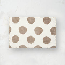 beige dune and white polka dot placemat with blanket stitched edge
