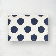 indigo and white polka dot placemat with blanket stitched edge