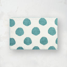 teal lagoon and white polka dot placemat with blanket stitched edge