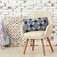 josie decorative throw pillow in indigo styled on an armchair