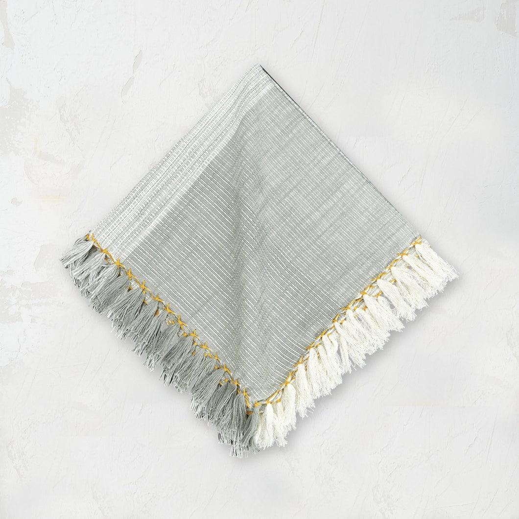 boulder kerbey cloth napkin with yellow ochre edge stitching and tassel fringe