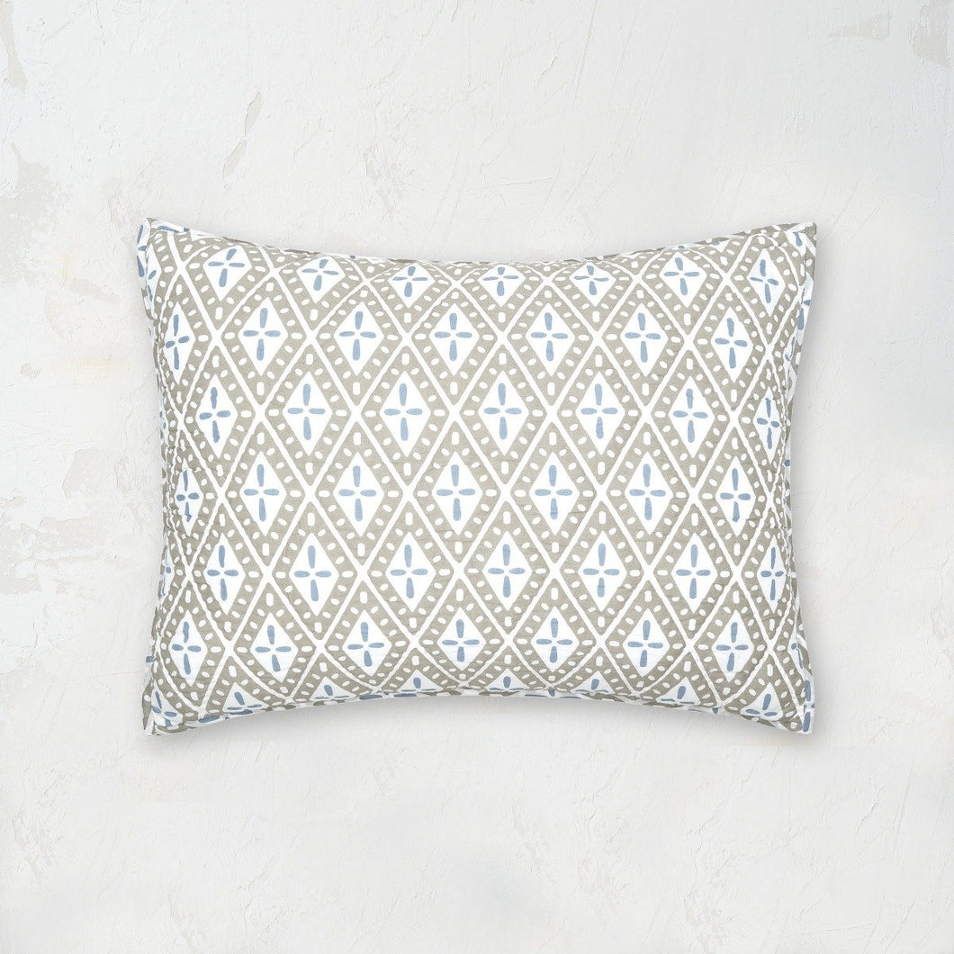 liam standard sham featuring a white blue and tan geometric pattern