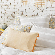 mason gray and white striped duvet cover styled with yellow accents