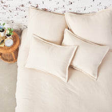 cream monroe blanket and matching pillows on a bed