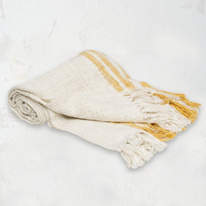 hand woven ochre and white morgan throw with hand-tied fringe