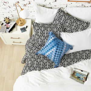 naya quilt set styled with white and blue accents