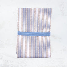tan and blue striped dishtowel