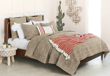 saunders quilt set styled with red accents